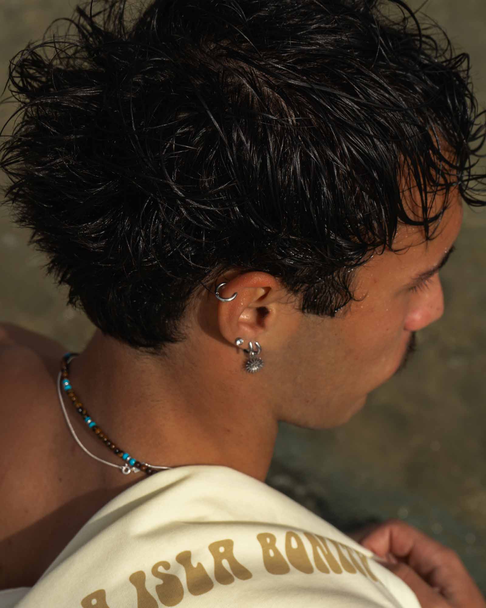 10mm stainless steel earring - Hoop earring in the helix area of the model's ear