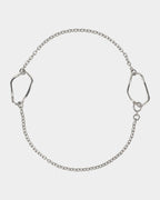 Statement necklace in stainless steel on a white background