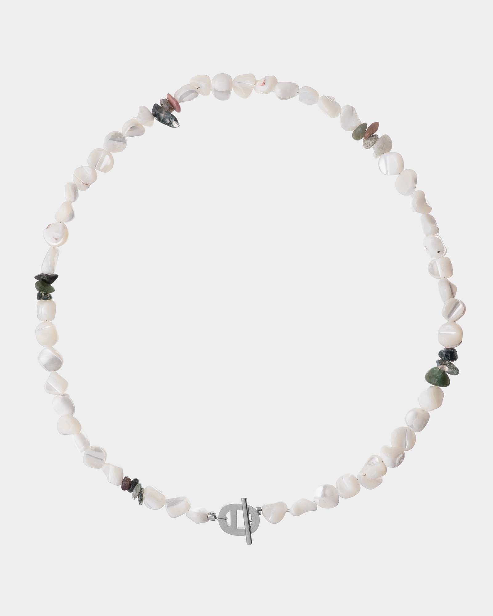 Necklace with white beads and small colored stones on a white background