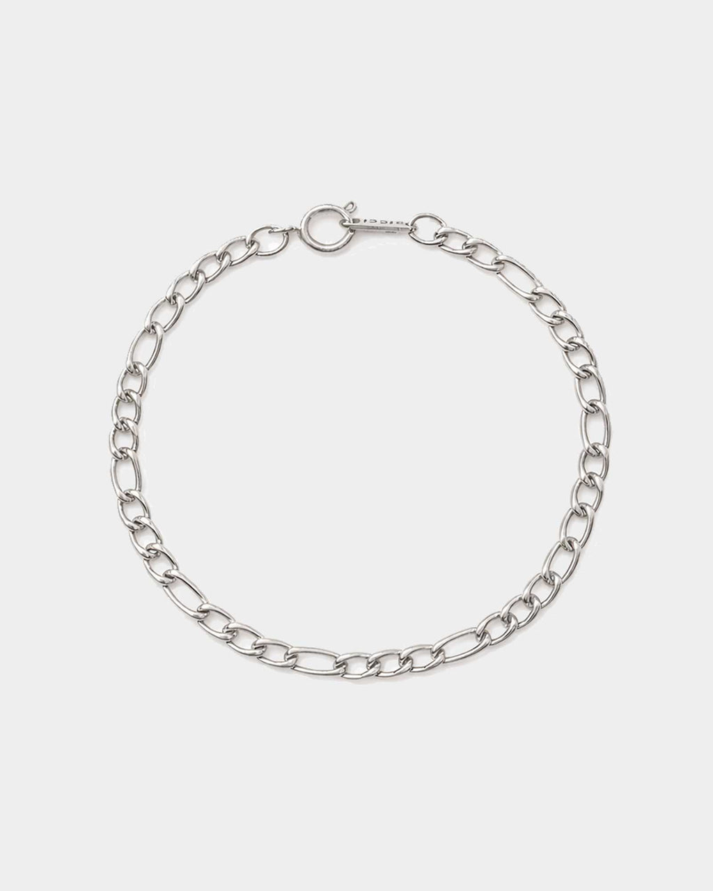 Silver chain bracelet on a light gray background