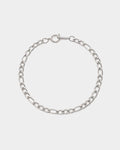 Silver chain bracelet on a light gray background