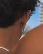 Santa Cruz - Stainless steel earring on the model's ear from a rear perspective 
