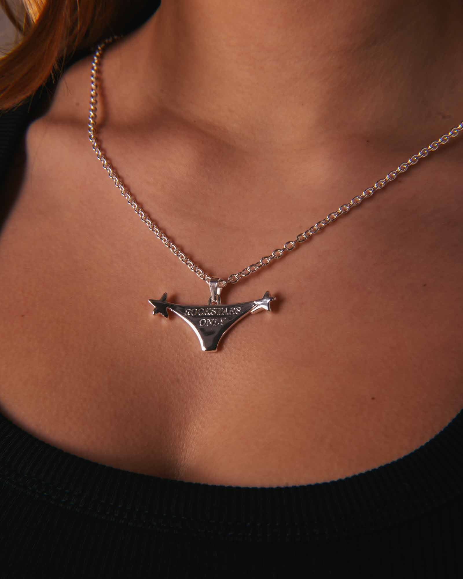 Silver necklace with a pendant on a person's neck - Rockstars Necklace