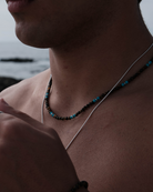 benny necklace in natural stones, placed around the model's neck