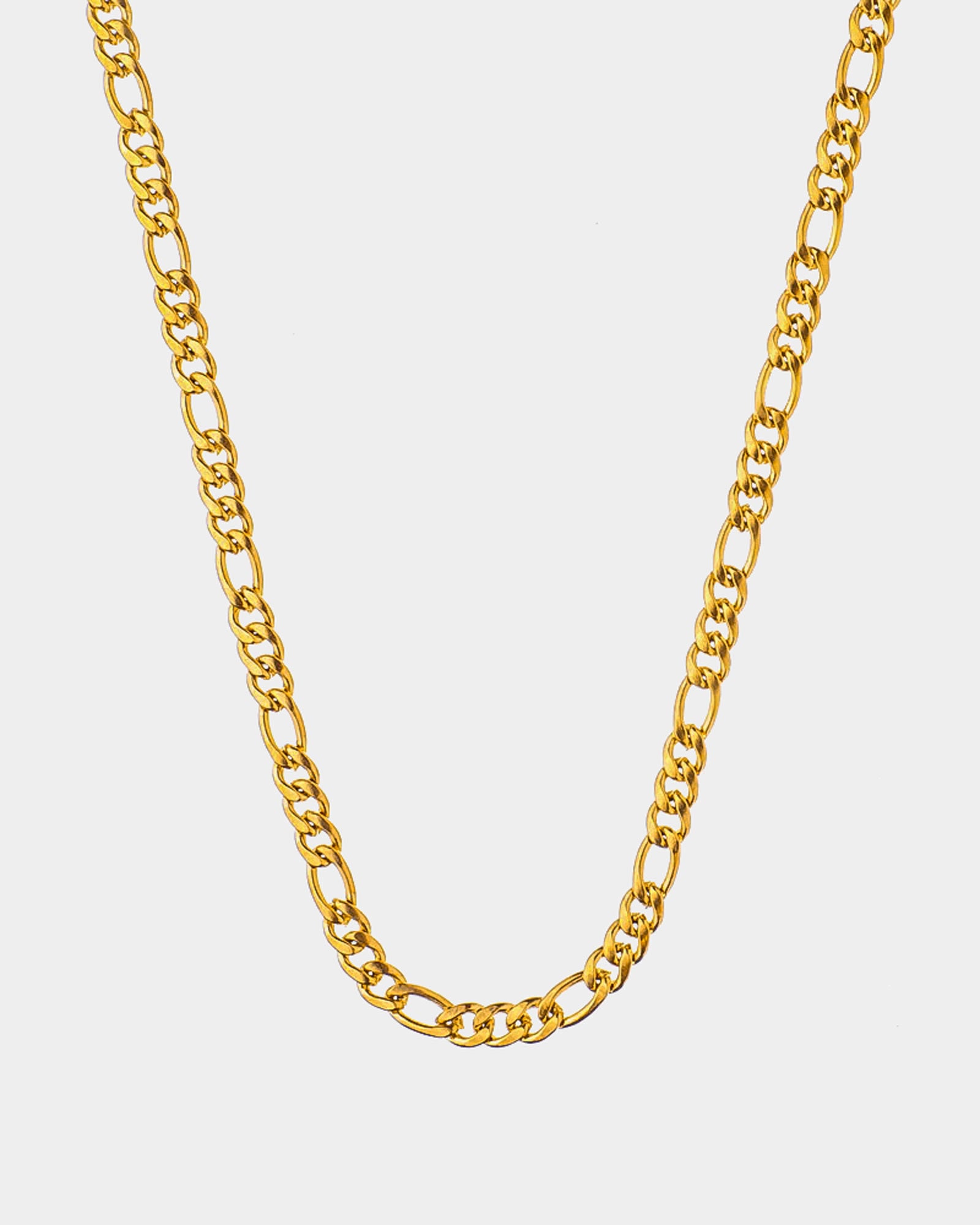 A golden figaro chain necklace displayed against a light gray background.