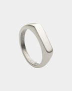 Flat top ring in stainless steel with silver finish on a white background