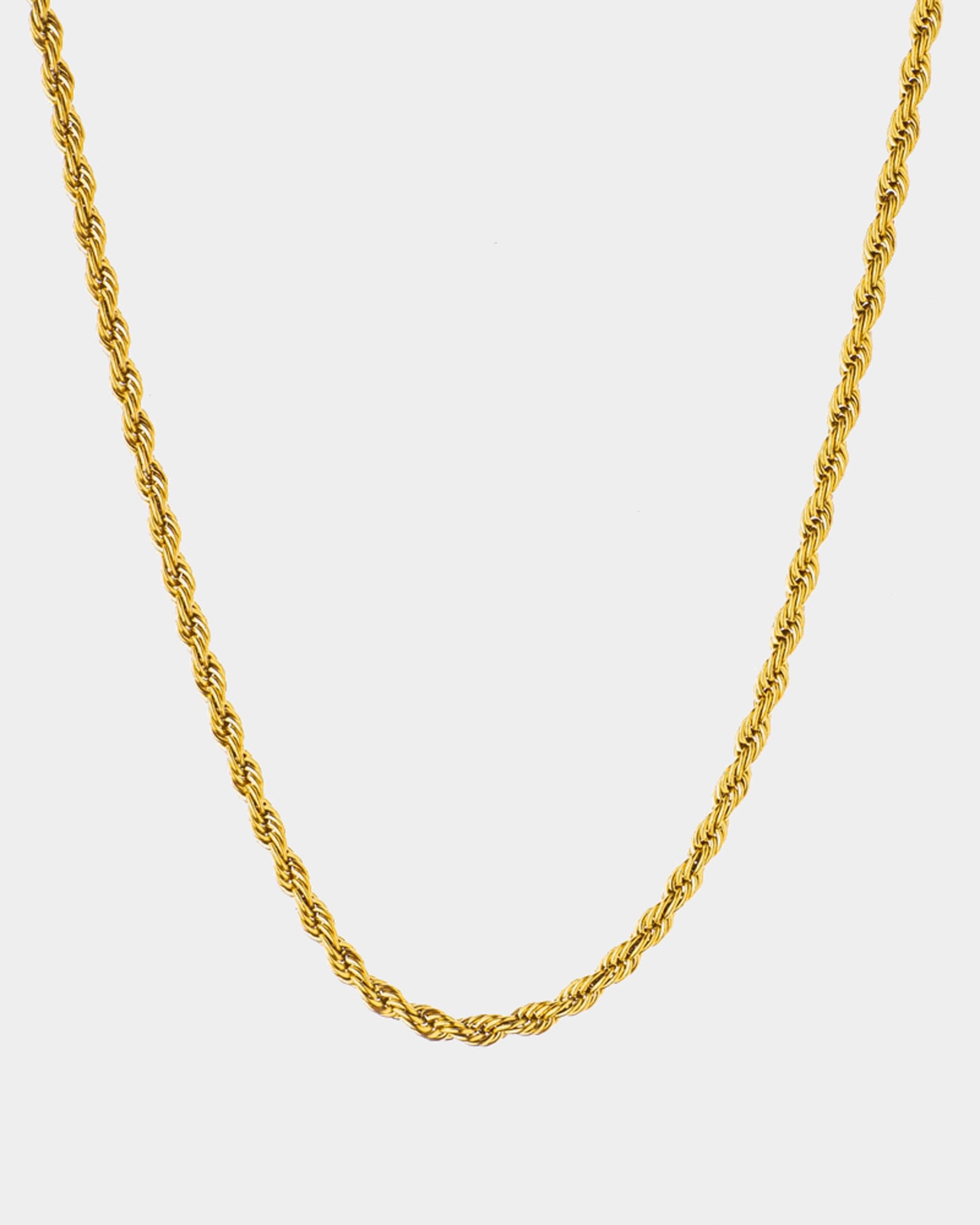 A golden rope chain necklace shown against a light gray background.