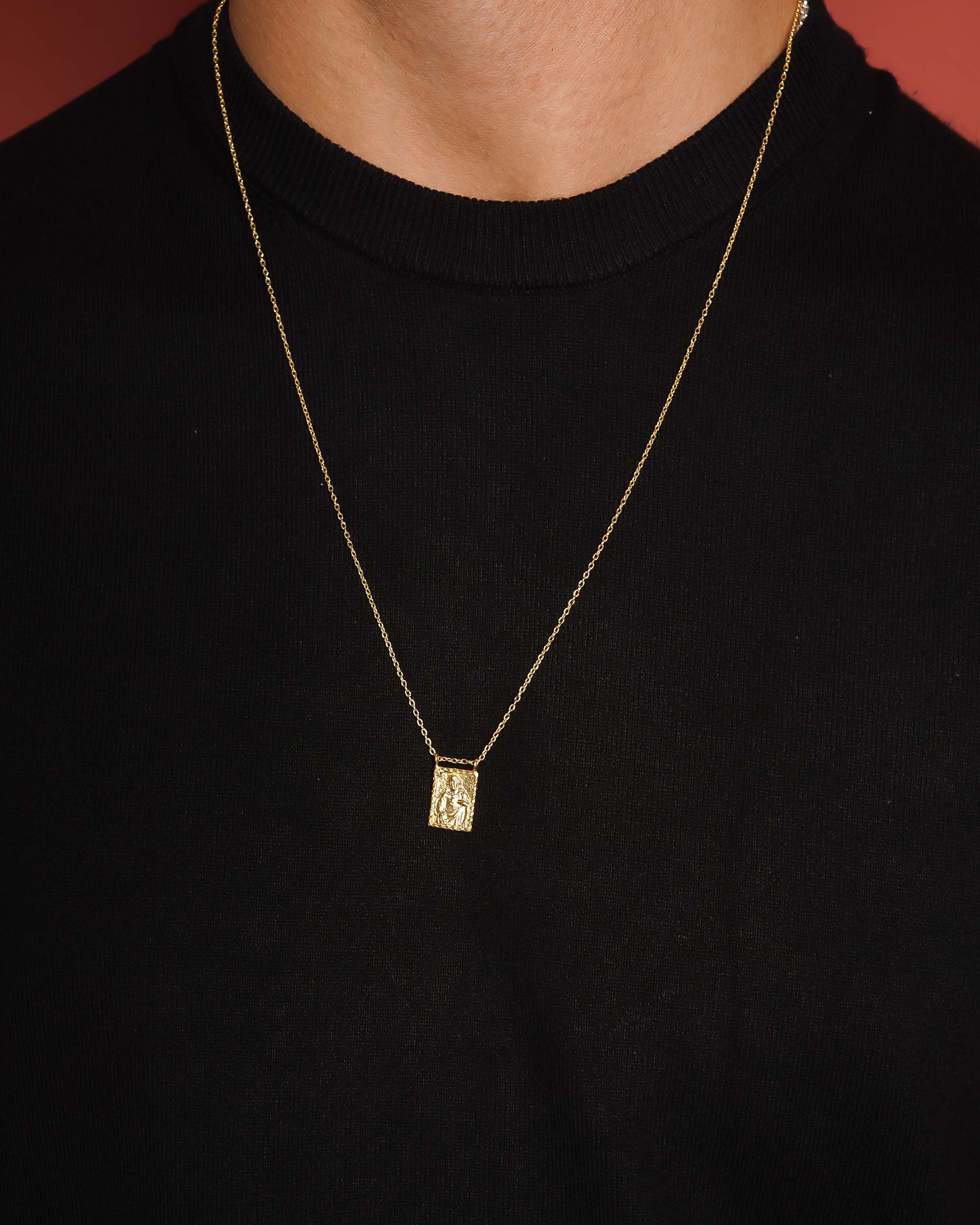 Golden Sacred Heart Scapular worn by man