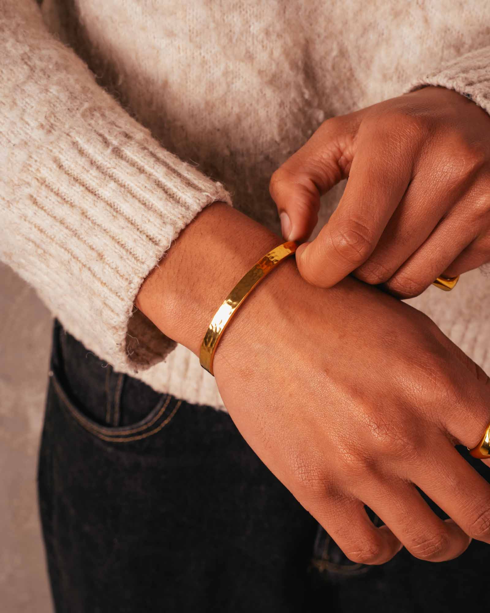 men wearing hammered cuff bracelet gold