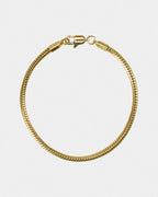 A golden snake bone chain bracelet with a width of 0.3cm, displayed against a white background.