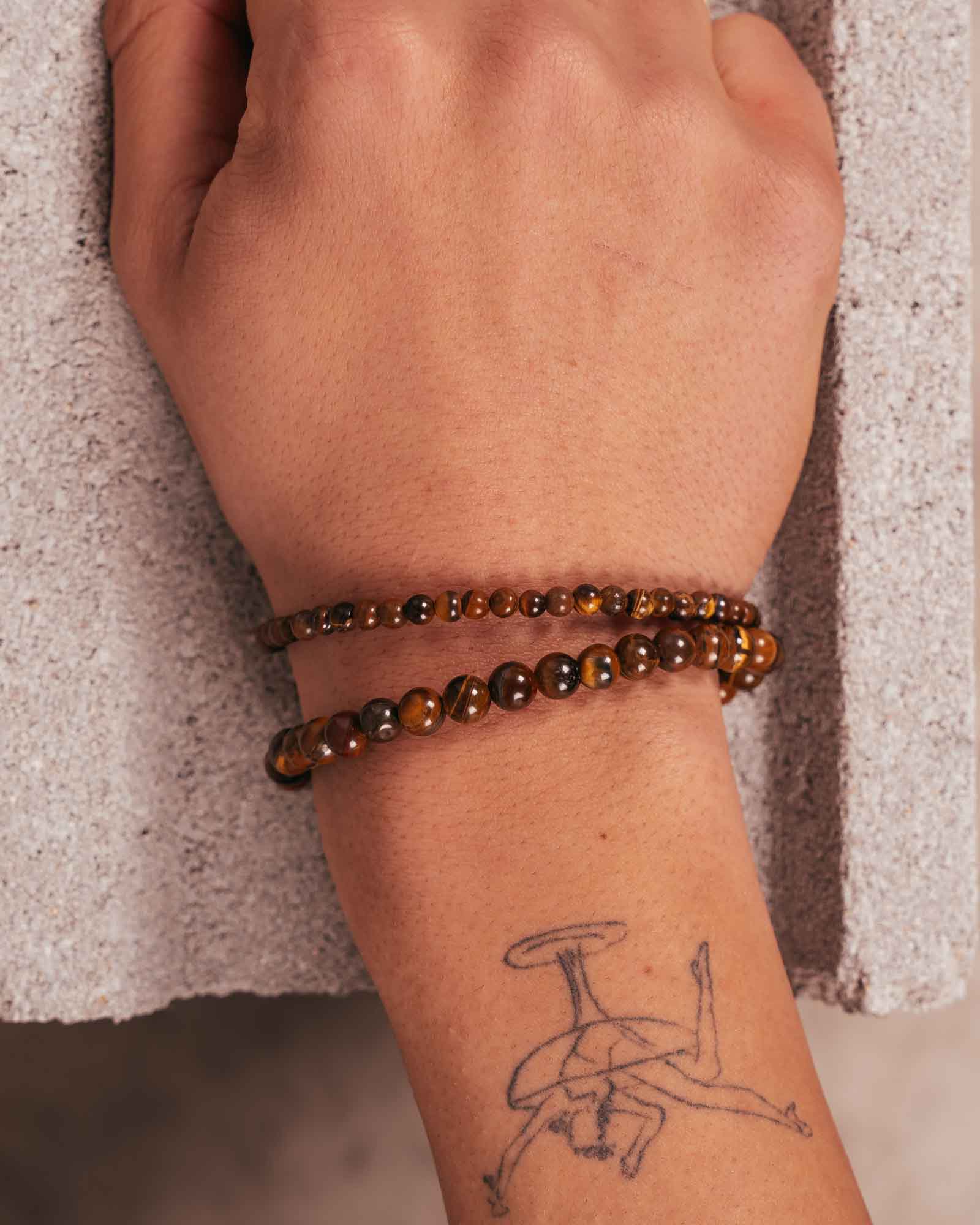 silver Tiger Eye Bracelet 4mm on a model's wrist - Natural Stone Bracelet - Dicci