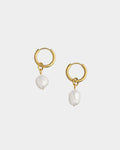 Golden pearl drop earrings on a white background