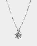 Silver necklace with a star-shaped pendant on a light gray background