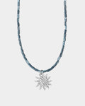helios necklace on light silver background