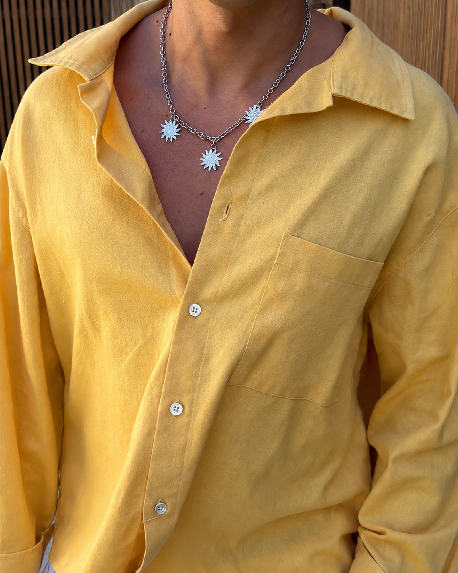 man wearing trivia necklace