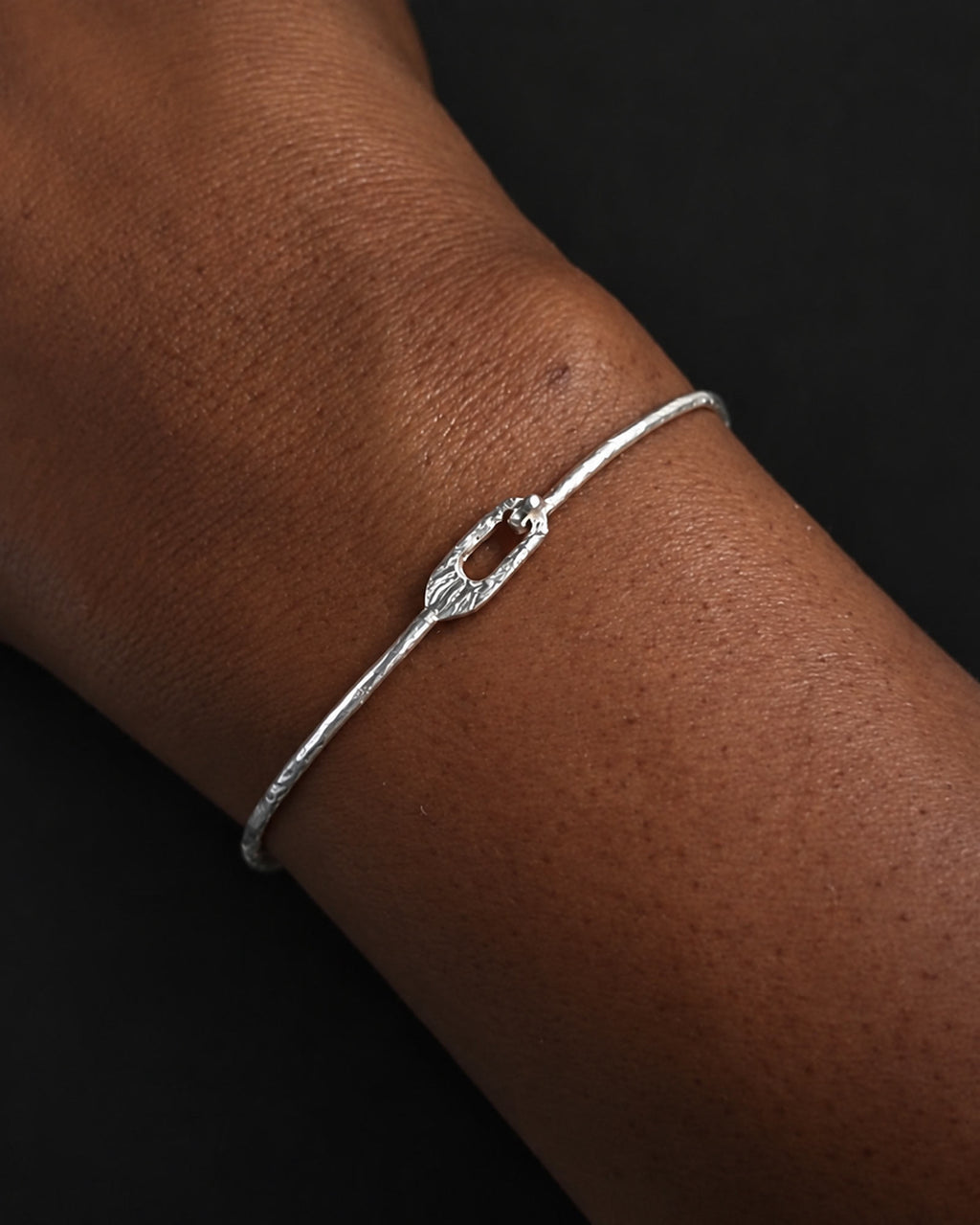 men wearing thin hammered silver bangle