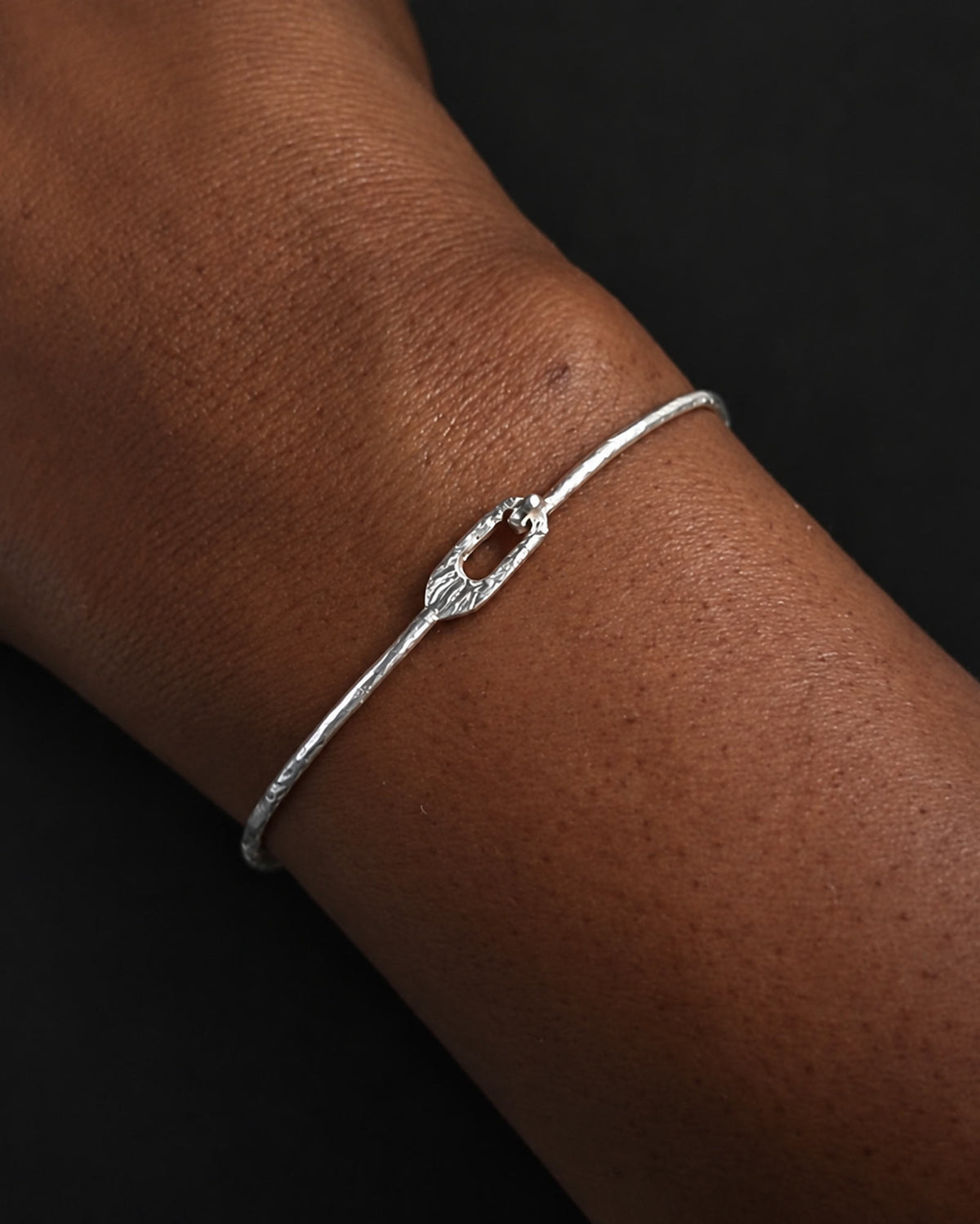 men wearing thin hammered silver bangle
