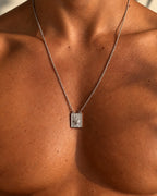 men wearing flaming heart scapular silver