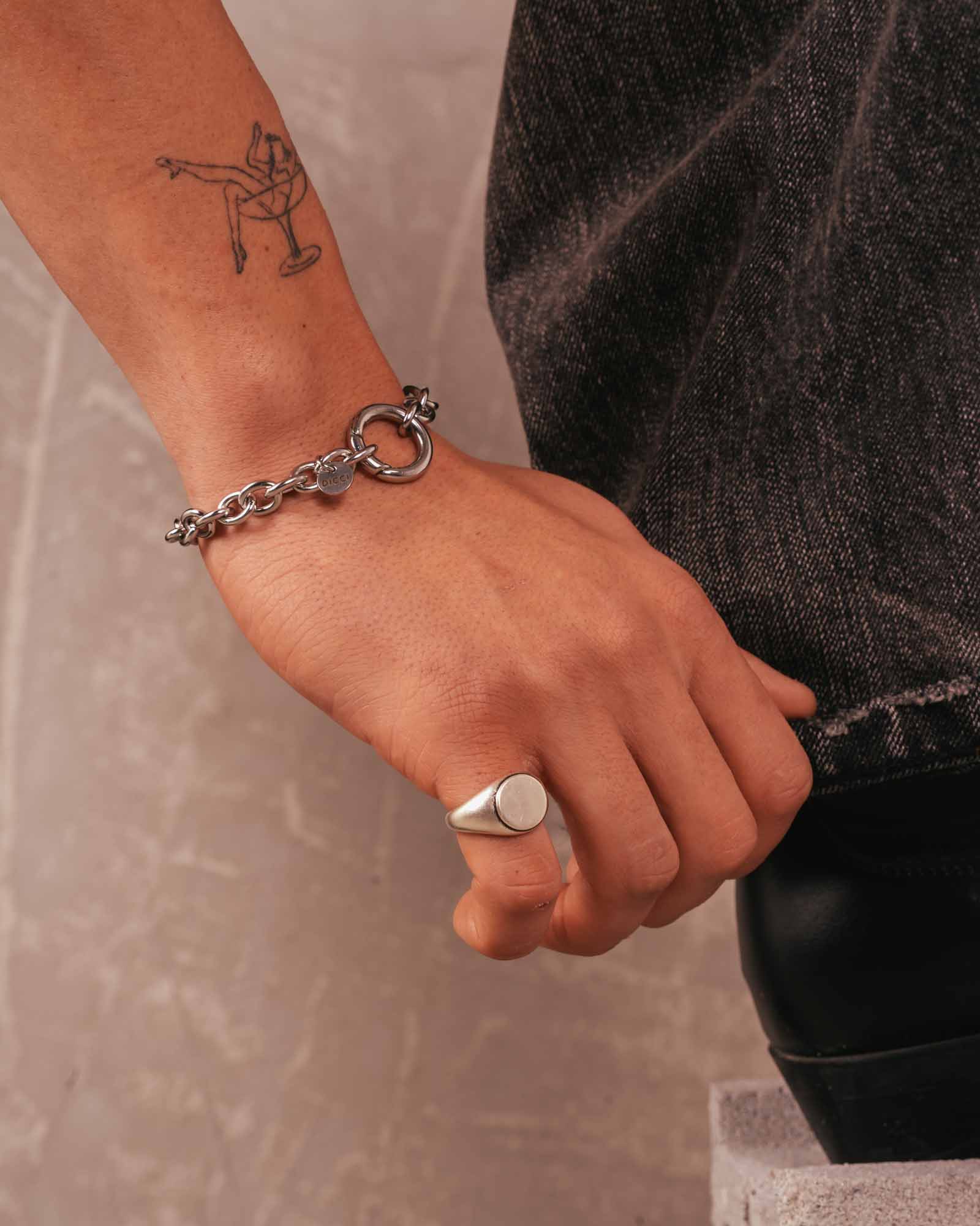 men wearing bold signet ring silver