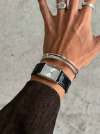 men wearing muse silver leather strap