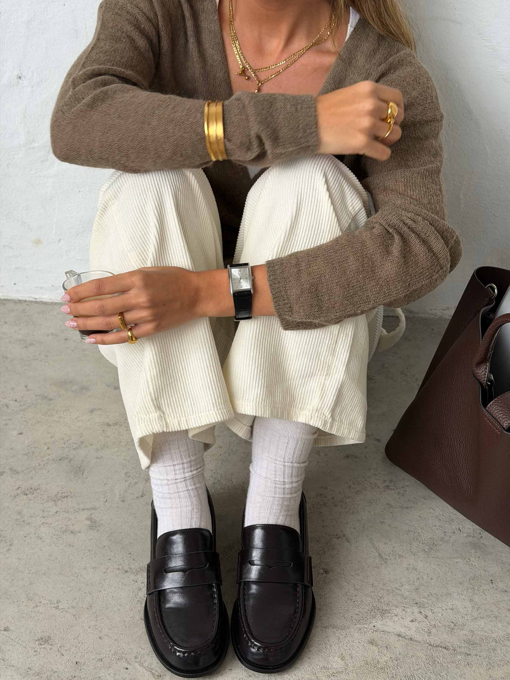 women wearing muse silver leather strap watch