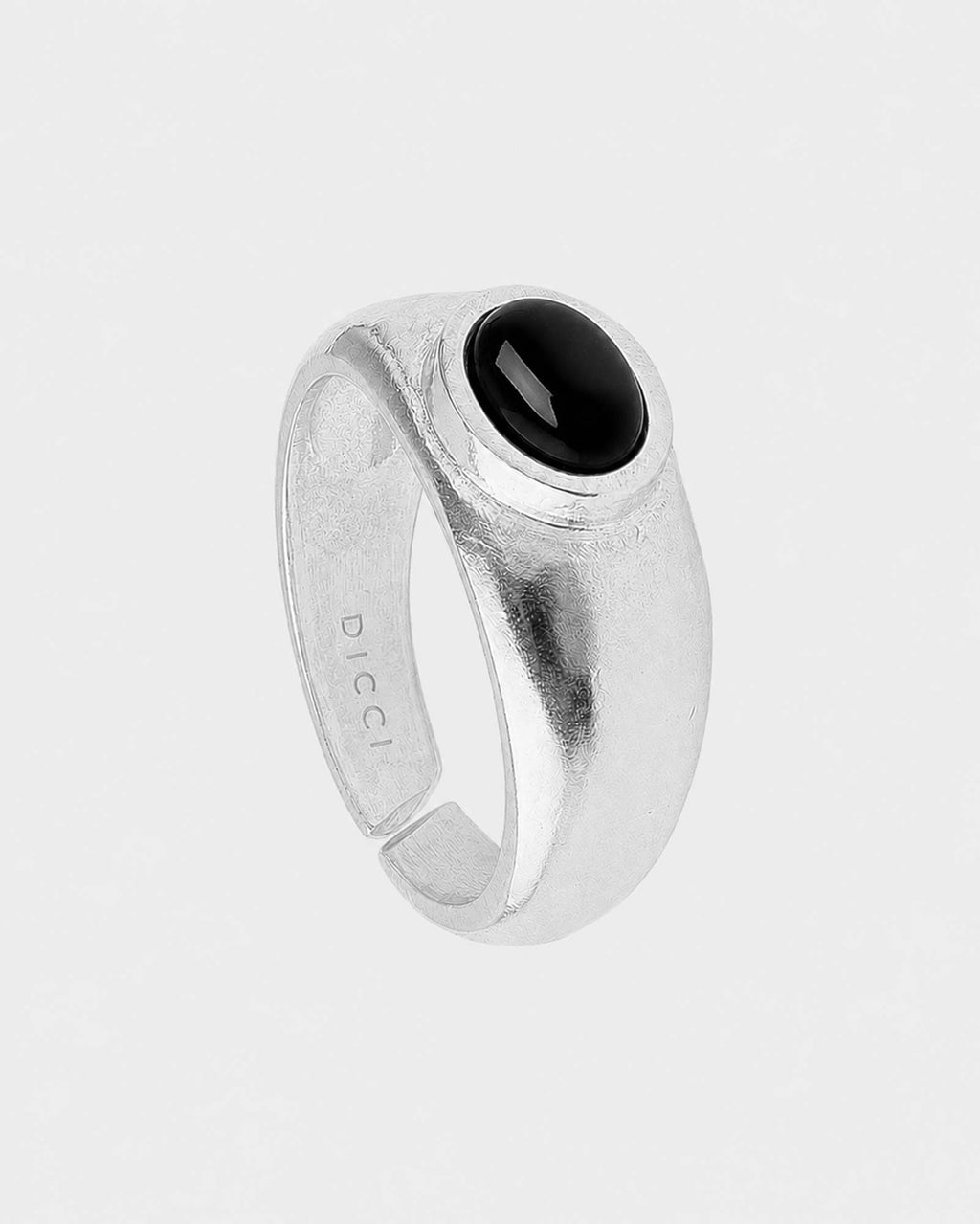Silver ring with a black onyx gemstone on a white background