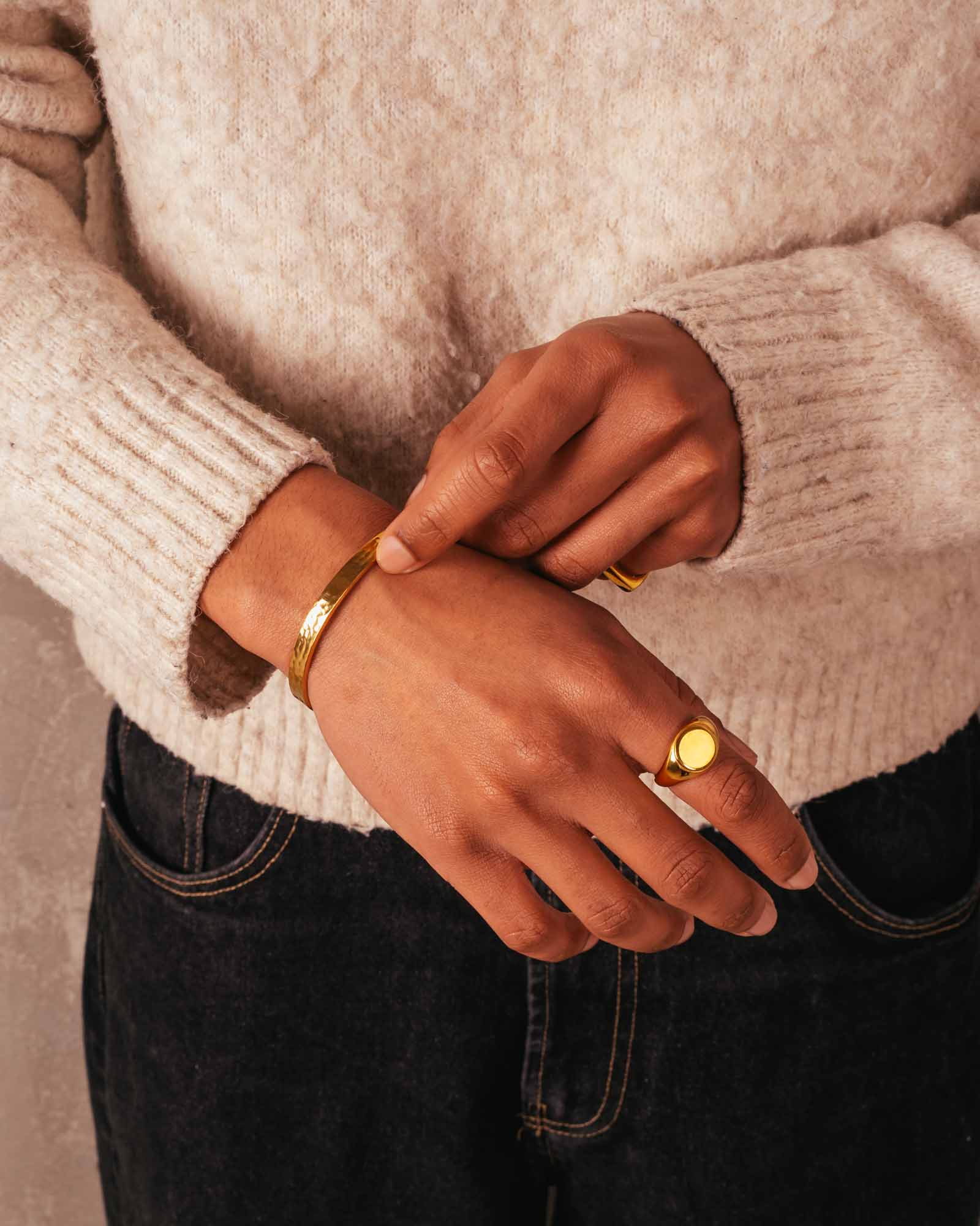 men wearing bold signet ring golden
