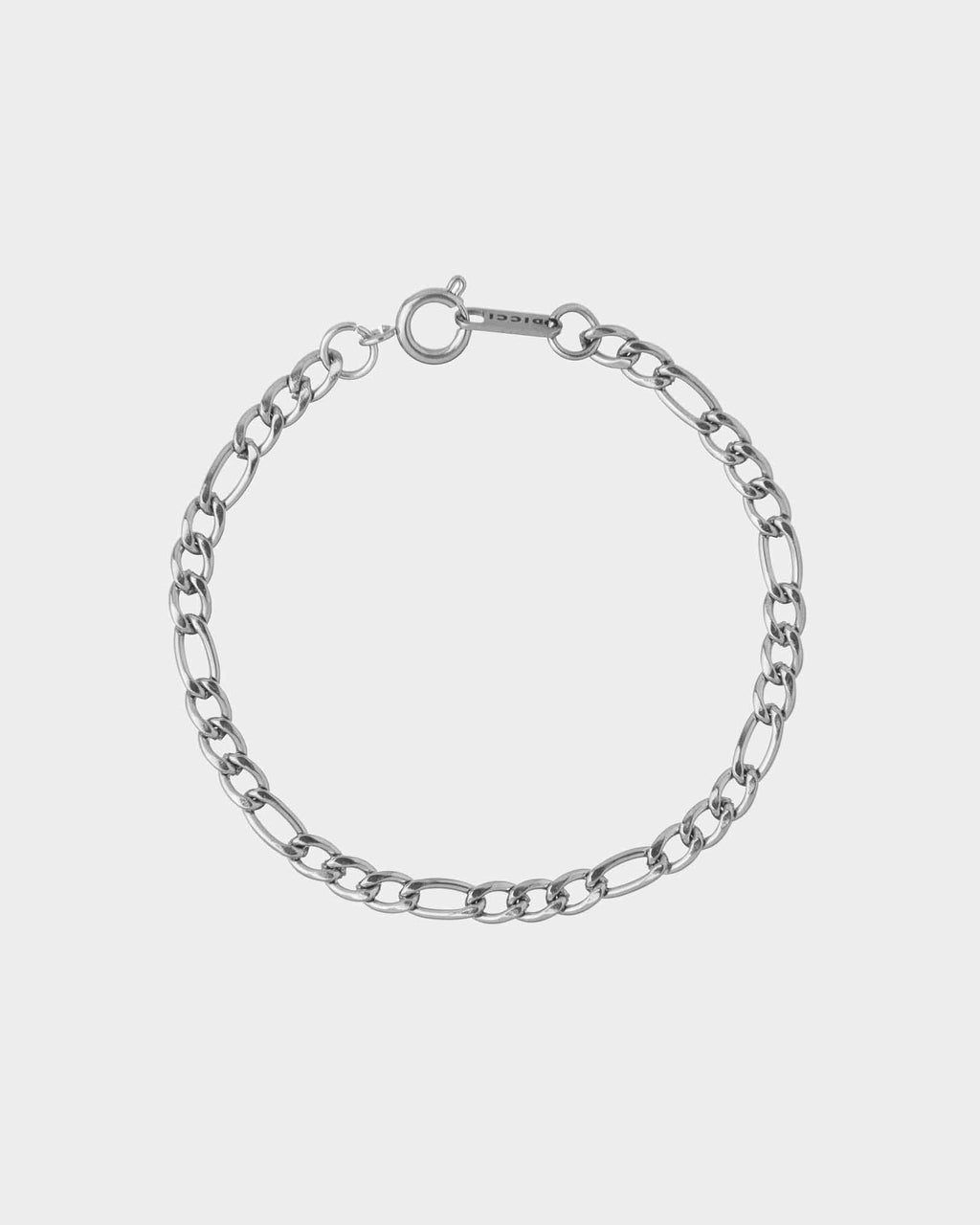 Silver chain bracelet on a light gray background