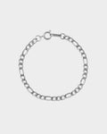 Silver chain bracelet on a light gray background