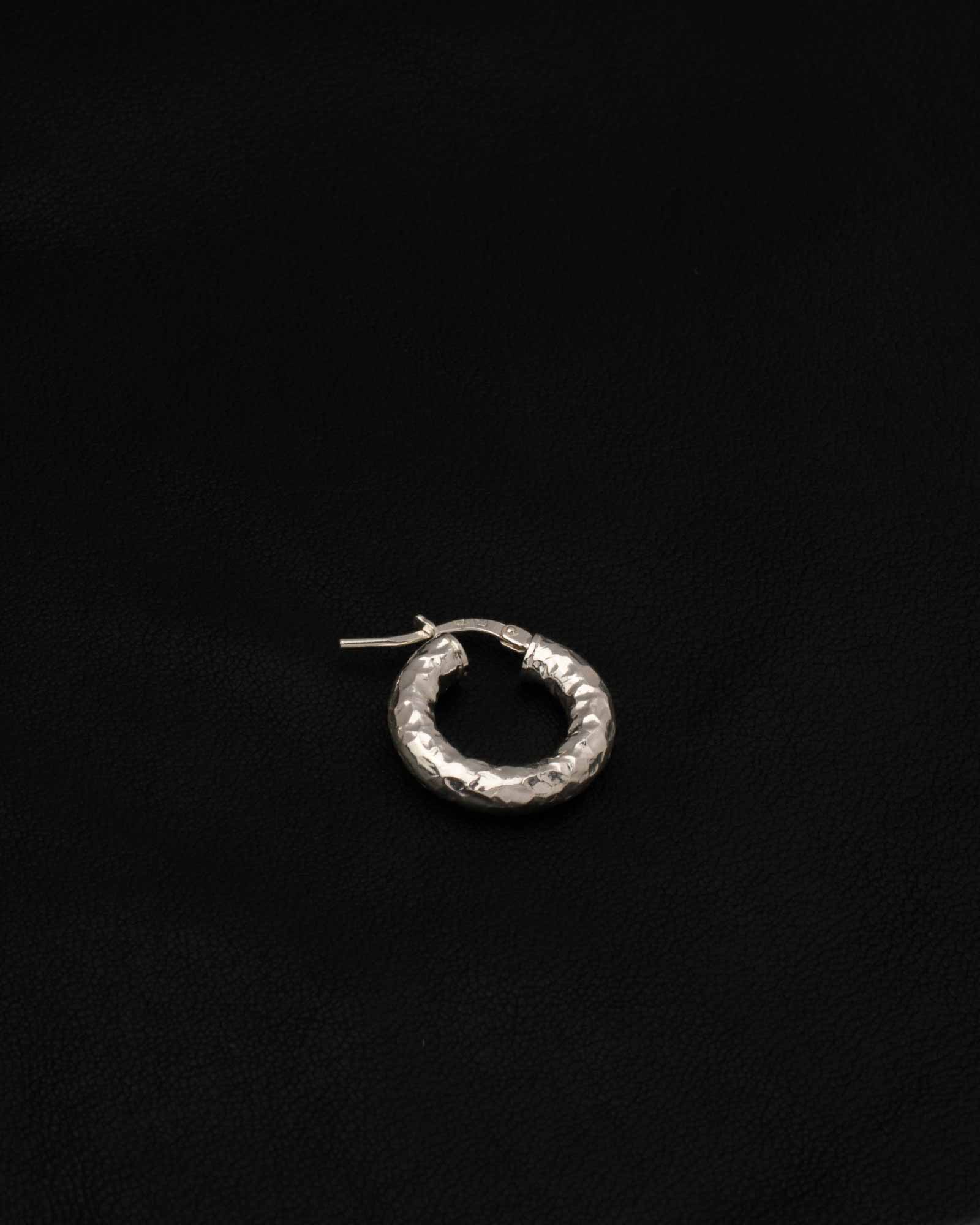 Hammered Silver 925 Earring in textured black leather background
