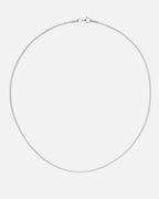 A silver snake chain necklace with a clasp, laid out on a plain background.