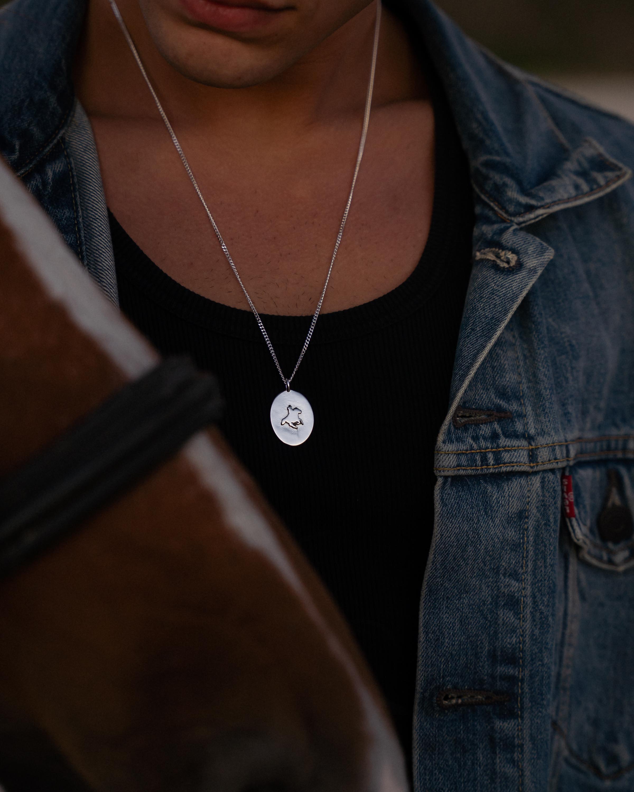 man wearing western necklace 