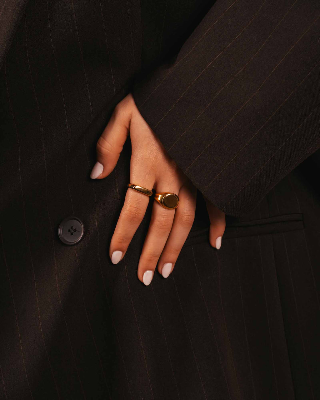 women wearing bold signet ring golden