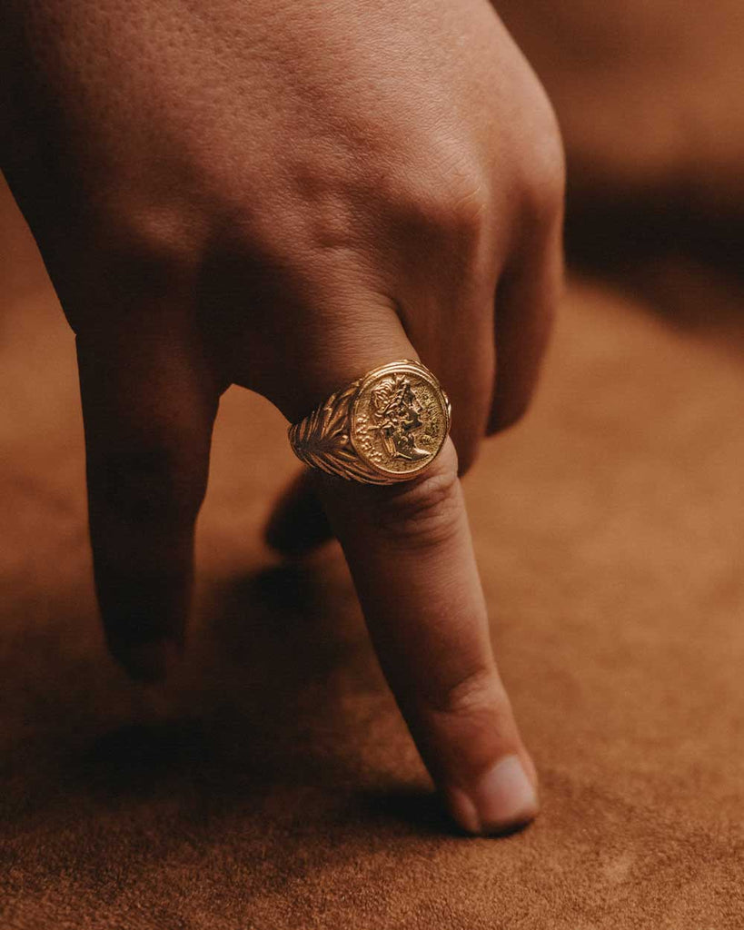 Caesar Ring in Golden Stainless steel on the models finger - Buy Rings Online - Dicci