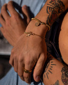 Man wrist with golden stainless steel bracelet