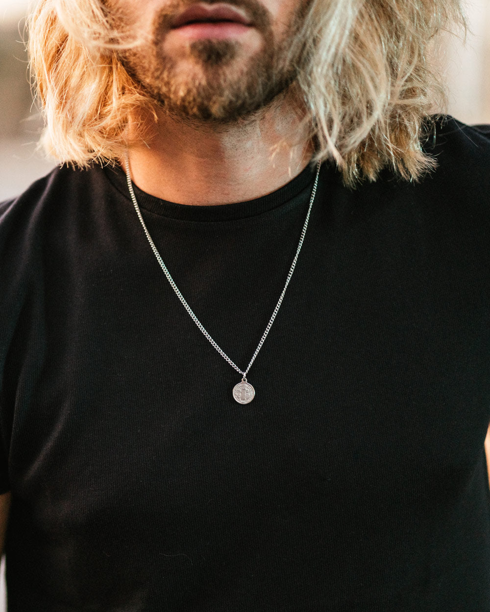 St. Benedict's Necklace - Stainless Steel Necklace with double engraved 'St. Benedict's' Pendant on the models neck - Online Unissex Jewelry - Dicci