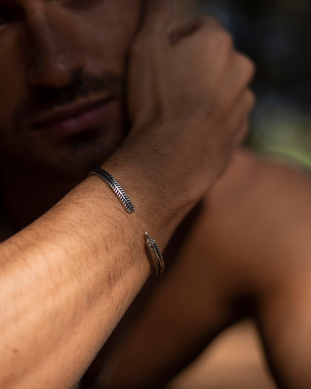 Feather - Stainless Steel Cuff Bracelet on the models wrist - Stainless Steel Unissex Bracelets Online - Dicci