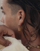 Golden Steel Earring Crawling Snake on the models ear - Steel Earrings - Online Jewelry - Dicci