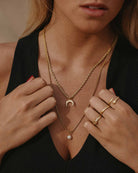 Golden Steel Necklace 'Pearl Drop' on the models neck - Pendant Necklace - Online Unissex Jewelry - Dicci